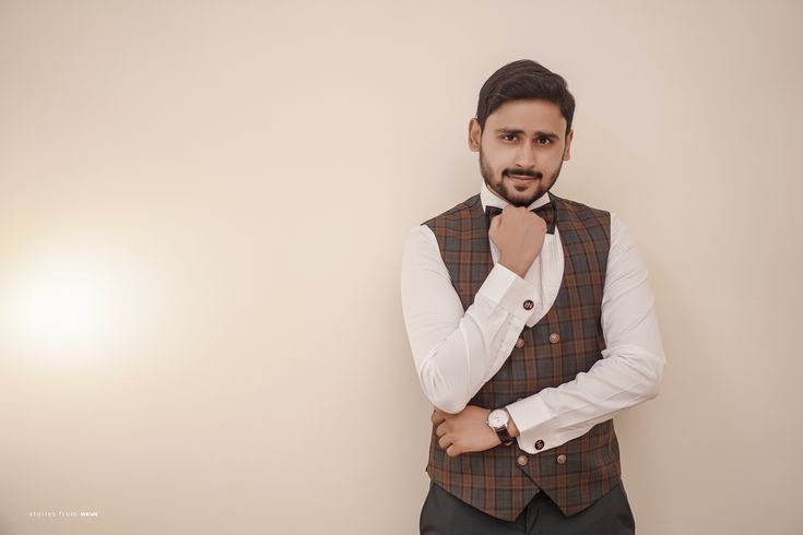 Man posing on sofa in suit Stock Photo by ©glediska 110740982